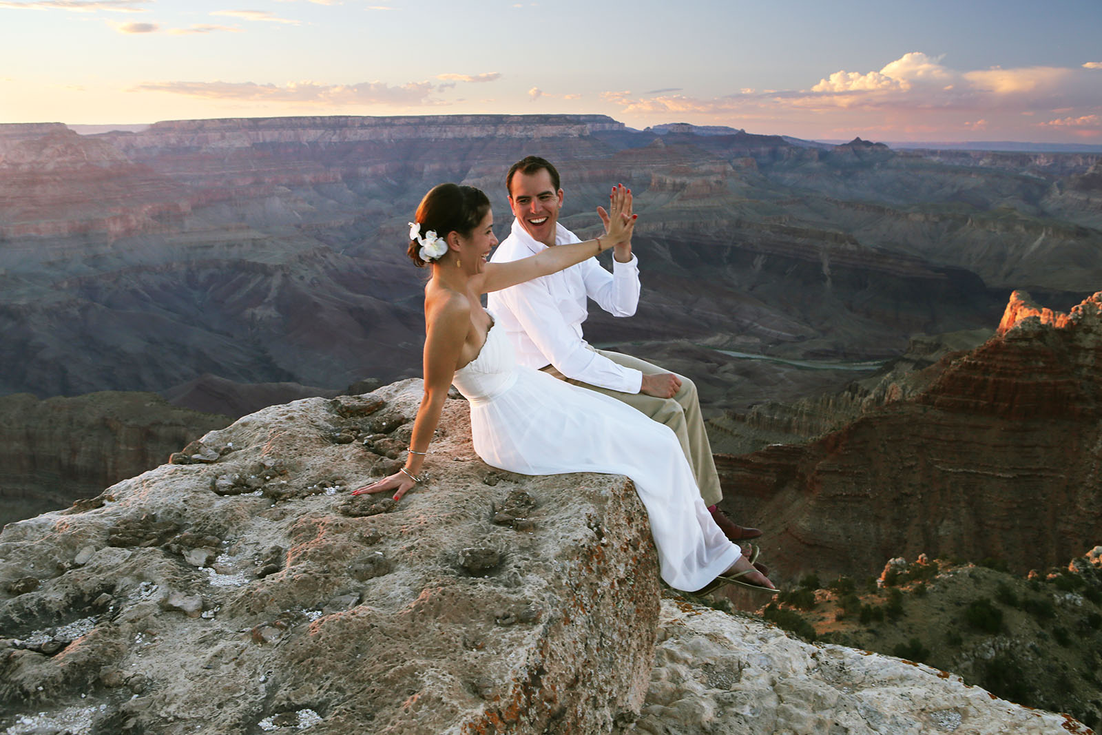 Young eloping couple celebrating their wedding at the Grand Canyon