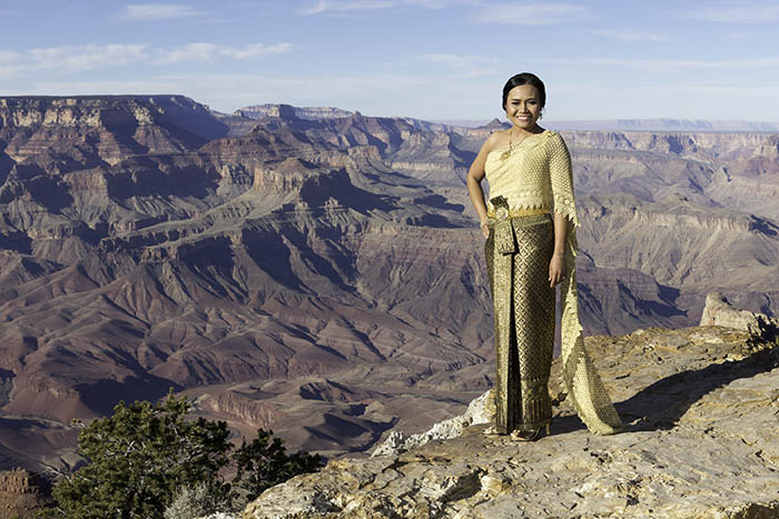 Thai bride standing at the Grand Canyon in a traditional Thai wedding dress