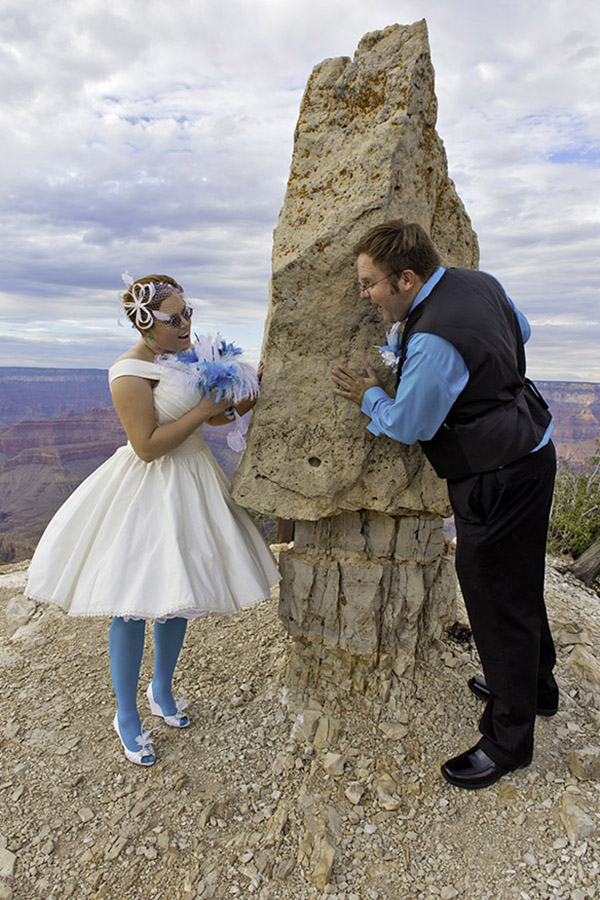 Bride and groom at Shoshone point looking around the prominent rock on the point.