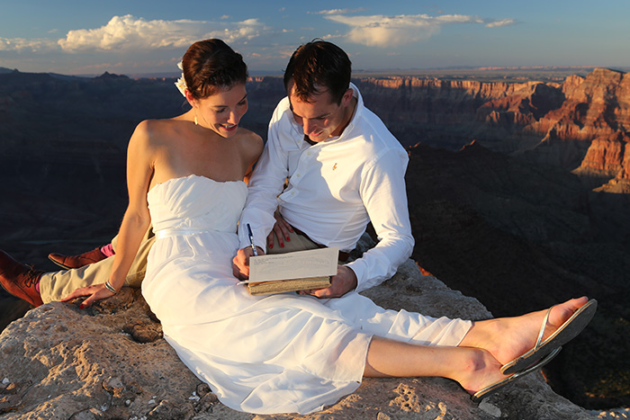 Newlyweds signing their wedding license at the Grand Canyon