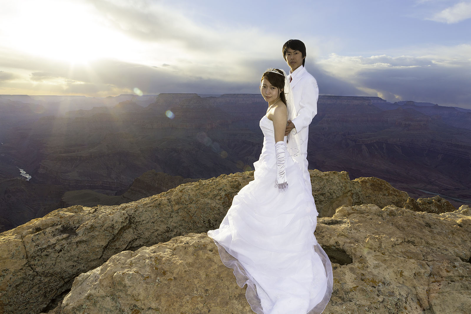 A Japanese couple posing for wedding photos at the Grand Canyon. Photograph by Mark Haughwout at Lipan Point.