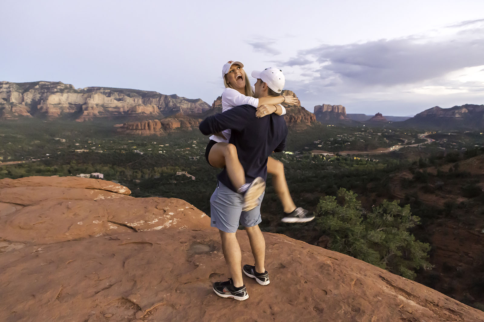 Excited bride to be jumps on her fiance when given a surprise wedding ring while on vacation in Sedona